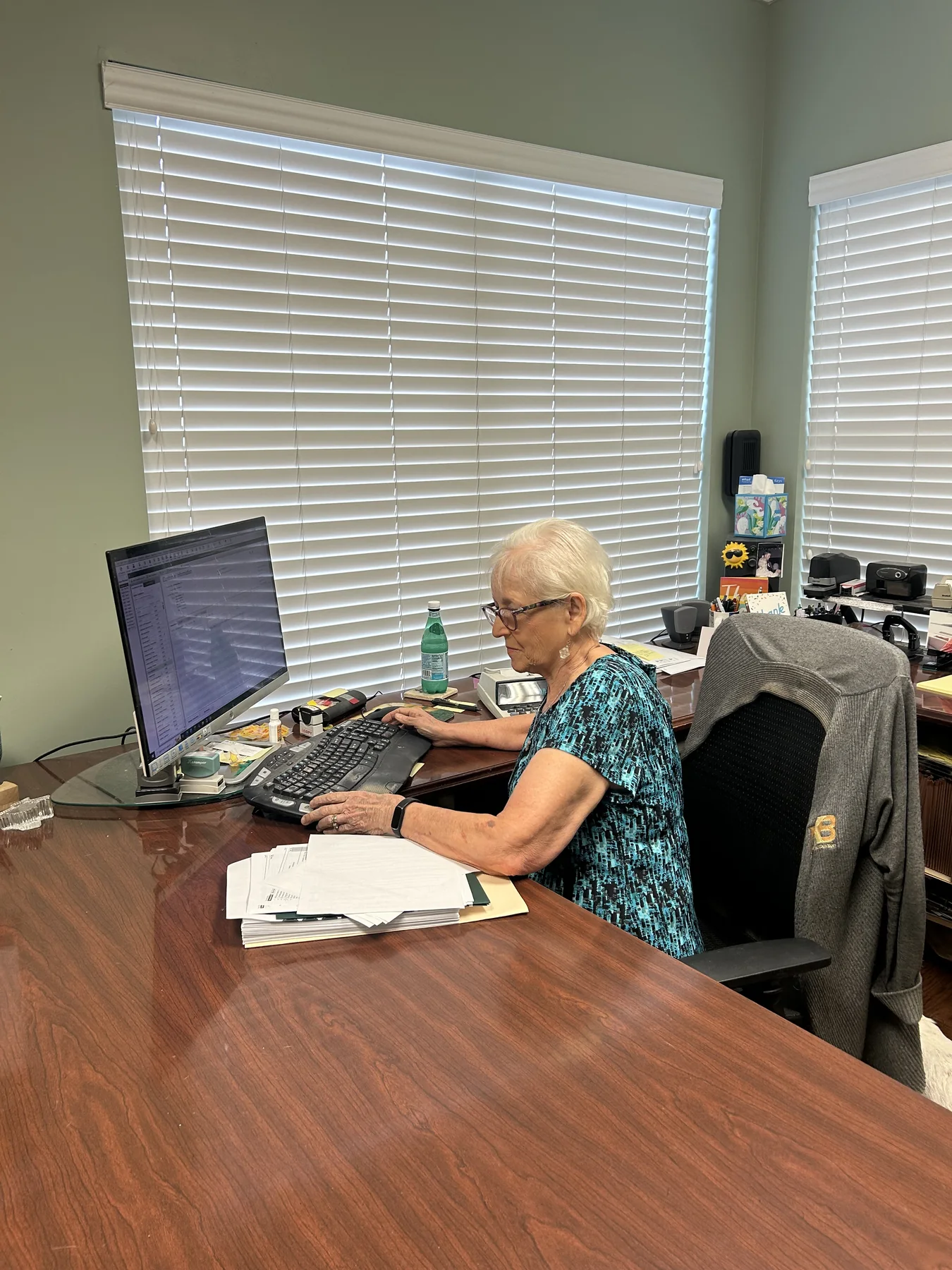 Dianne Briery entering information at her computer